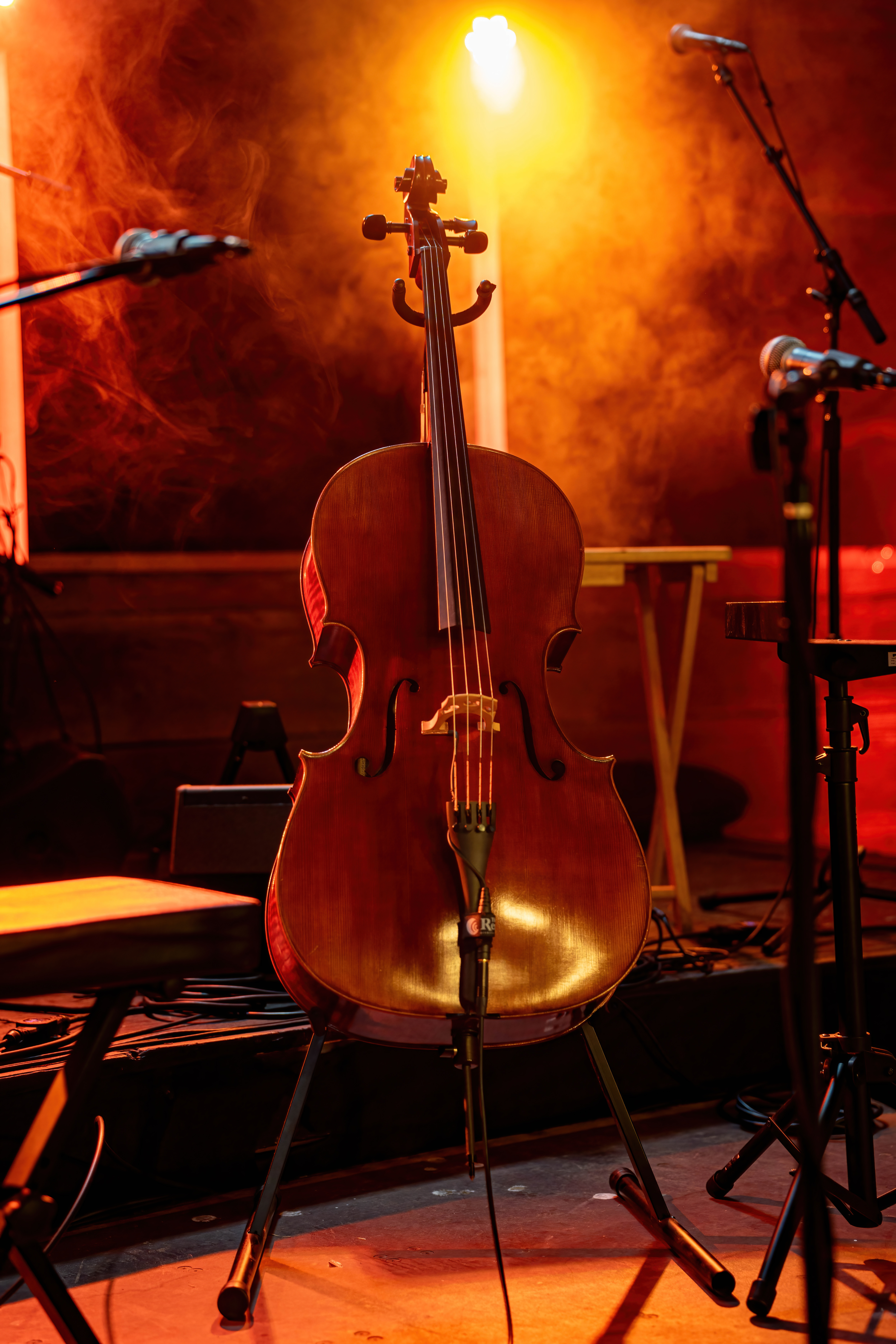 Live music photography — cello on stage with warm amber lighting